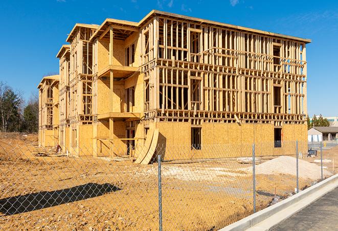 a temporary chain link fence surrounding a construction site, requiring strict safety precautions in Sunland Park, NM